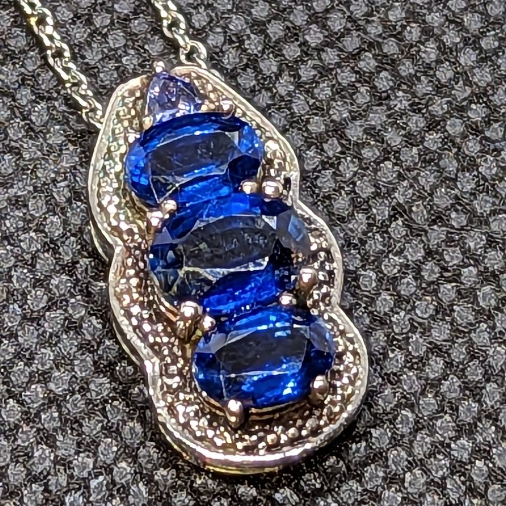 Large Triplet of Deep Blue London Topaz with iolite accent